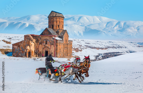 Horses pulling sleigh in winter - Ani Ruins, Ani is a ruined and medieval Armenian city - Kars, Turkey