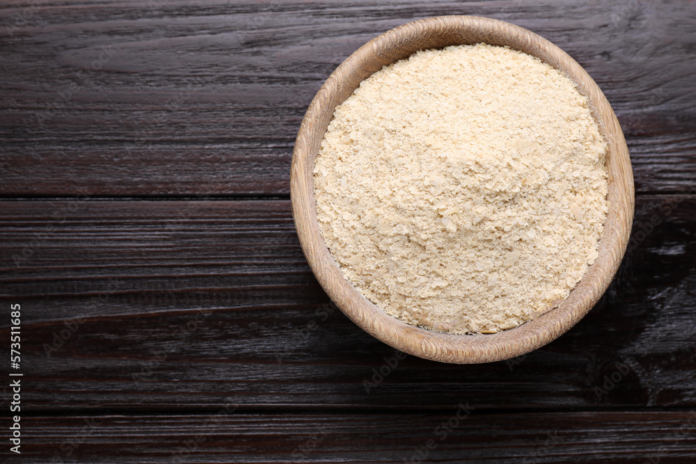 Beer yeast flakes on wooden table, top view. Space for text Beer yeast flakes on wooden table, top view. Space for text