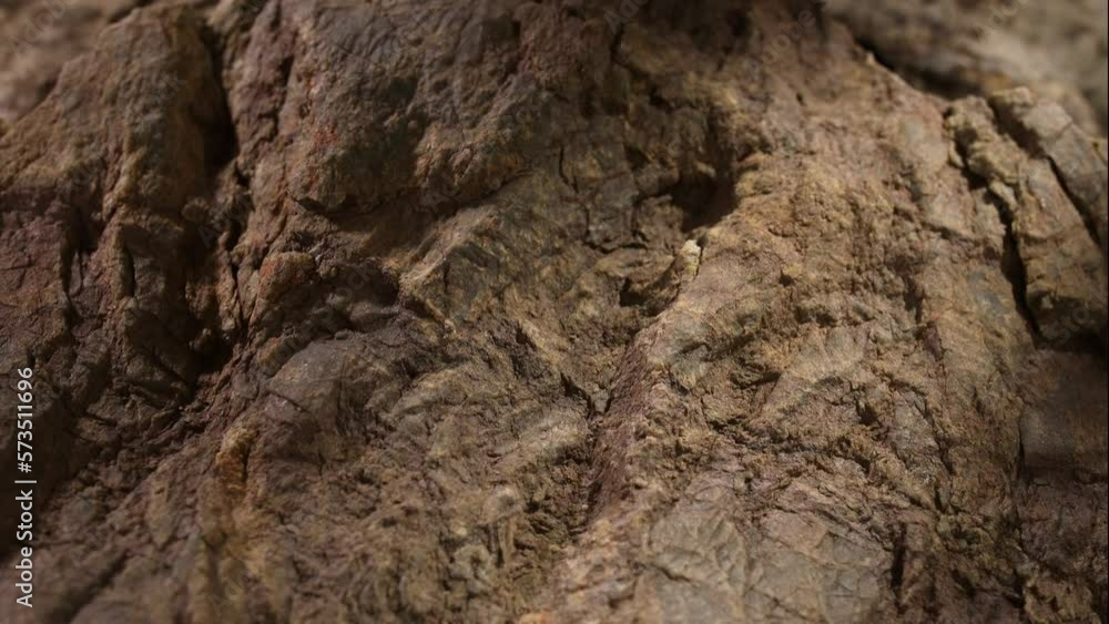 brown stone texture close-up. macro shot of a rock. natural mineral background. High quality 4k footage brown stone texture close-up. macro shot of a rock. natural mineral background. High quality 4k footage
