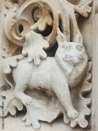cat carved in stone on the door of the church