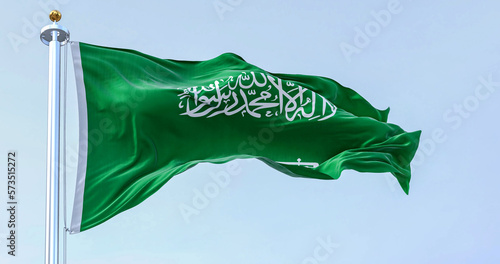 Saudi Arabia national flag waving in the wind on a clear day photo