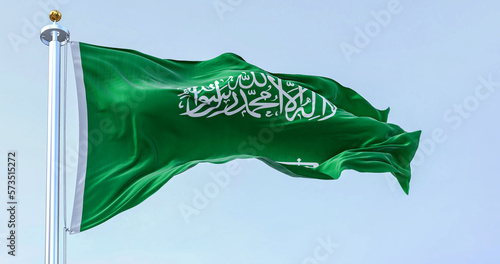 Foto Saudi Arabia national flag waving in the wind on a clear day