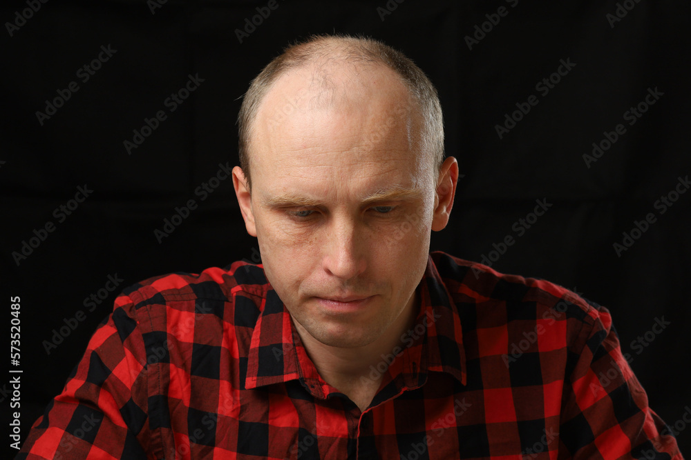 Caucasian man bowed his head in depression