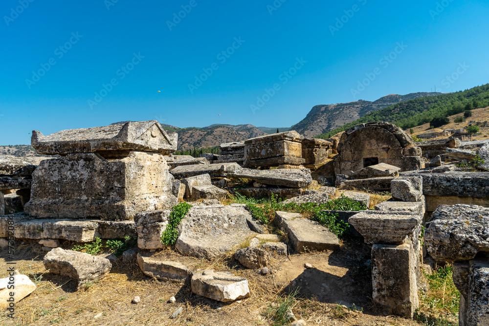 Ruins of travertine lahids in northern Necropolis of Hierapolis near Pamukkale, Denizli. Old grave monuments, tumulus graves. 