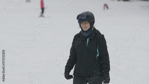 Happy woman skiing on winter mountain slope