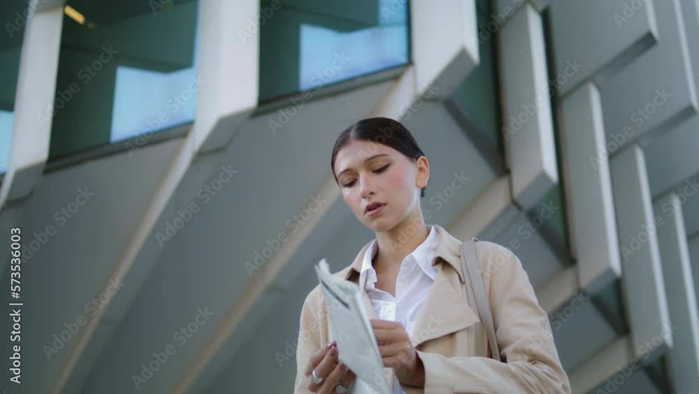 custom made wallpaper toronto digitalWoman reading newspaper street closeup. Business lady deploying periodical press
