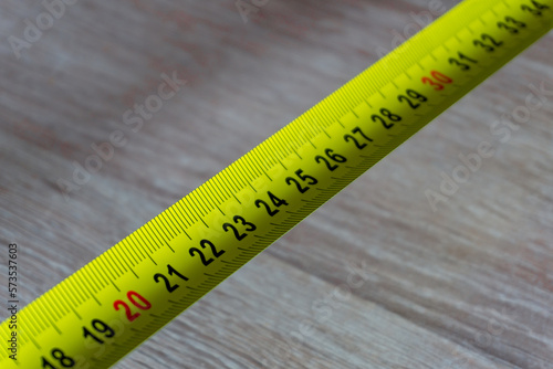 tape measure on a wooden background