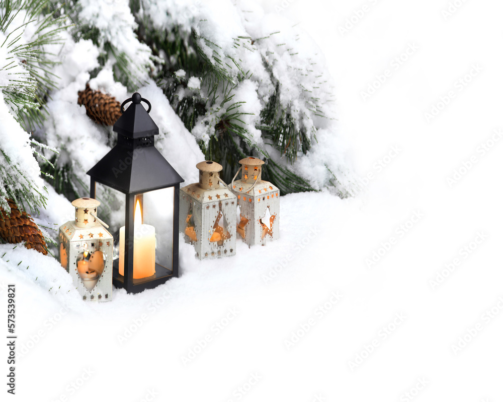 Naklejka premium Lanterns in the snow under the Christmas tree