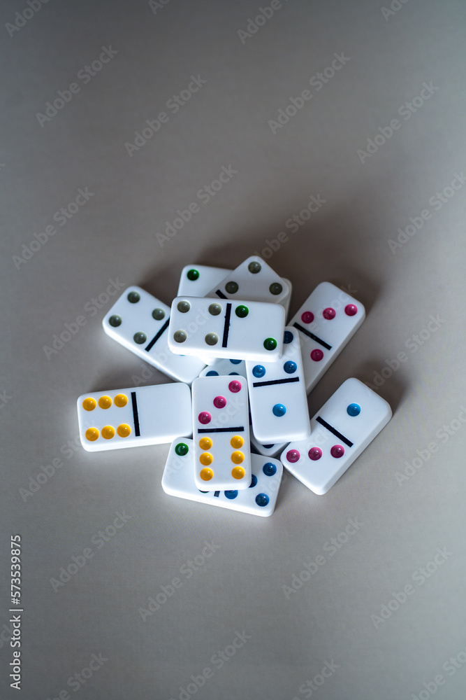 multi-colored dominoes on a gray-beige background
multi-colored dominoes on a gray-beige background