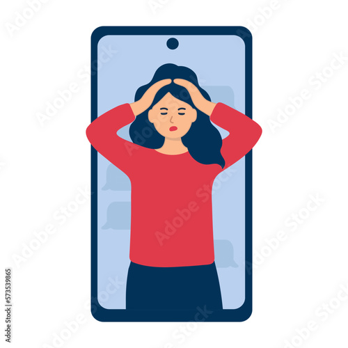 A young woman with dark hair is holding her head. Portrait in the phone in full face. Unpleasant online conversation. Shut off the conversation.