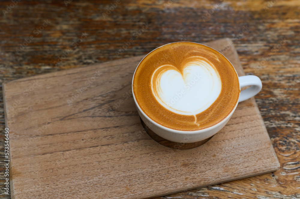 Top view of Hot coffee in white cup on wooden tray with Copy space Top view of Hot coffee in white cup on wooden tray with Copy space