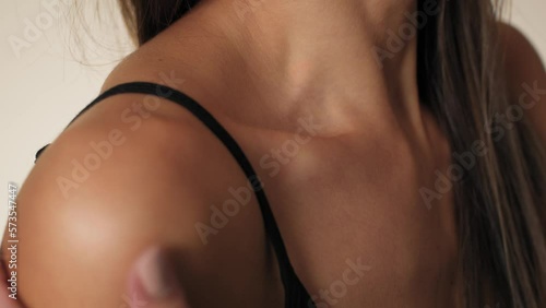 Close up of collarbone of unrecognizable woman in underwear. Shot with RED helium camera in 8K.  photo