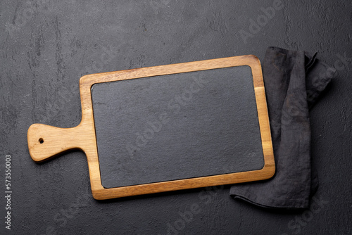 Wooden cutting board and kitchen towel