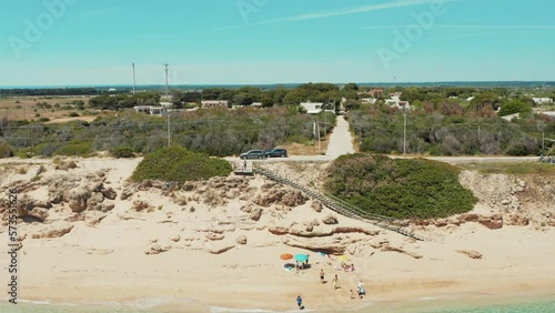 vista aerea della spiaggia di piri piri ( acquadolce cirenaica ) con il mare turchese cristallino , salento , campomarino di maruggio, taranto, italy photo