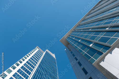 Looking up at tall buildings in Charlotte  North Carolina with perfect Carolina blue sky.
