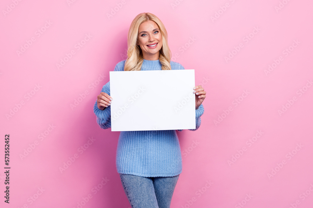 Photo of adorable pretty lovely lady wear comfort clothes presenting empty space new collection isolated on pink color background Photo of adorable pretty lovely lady wear comfort clothes presenting empty space new collection isolated on pink color background