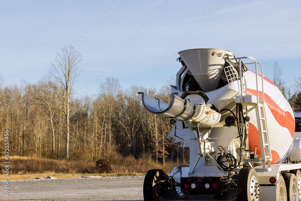 In construction site special concrete transport mixing truck is delivered ready to outpour concrete mix In construction site special concrete transport mixing truck is delivered ready to outpour concrete mix