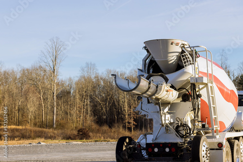 In construction site special concrete transport mixing truck is delivered ready to outpour concrete mix