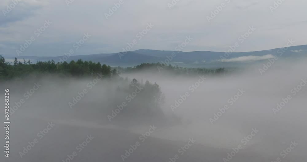 Misty early winter morning at lake where water evaporates creating dangerous fog Misty early winter morning at lake where water evaporates creating dangerous fog