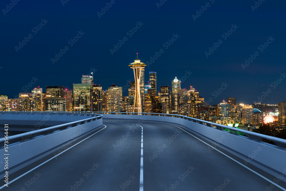 Obraz premium Empty urban asphalt road exterior with city buildings background. New modern highway concrete construction. Concept way to success. Transportation logistic industry fast delivery. Seattle. USA.