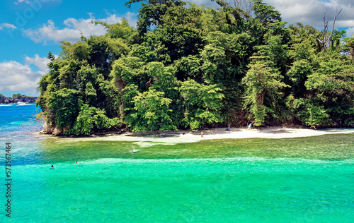 Beautiful caribbean island beach lagoon, white sand, turquoise water, green forest trees - Port Antonio, San San Beach, Jamaica