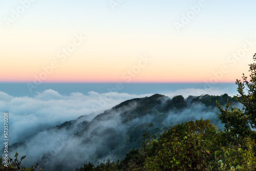 Panoramic view while morning mist covered partly mountain seen from the second highest peak mountain in Thailand, Doi Pha Hom Pok, Fang, Chiang Mai, Thailand. © ULTRAPOK