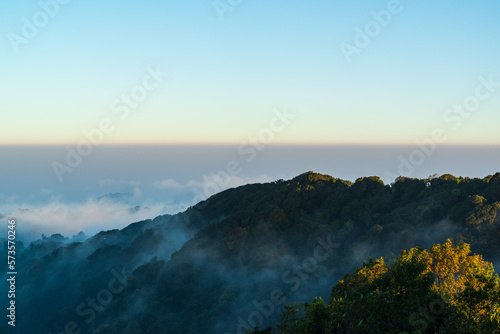 Panoramic view while morning mist covered partly mountain seen from the second highest peak mountain in Thailand, Doi Pha Hom Pok, Fang, Chiang Mai, Thailand.