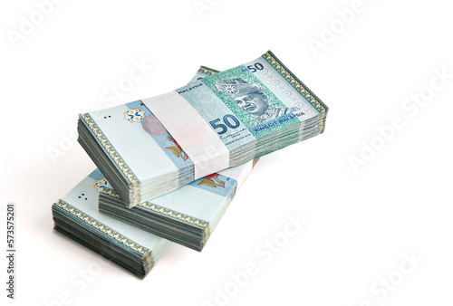 Stack of Ringgit Malaysia bank note on white background. Malaysia Currency Ringgit RM50 photo