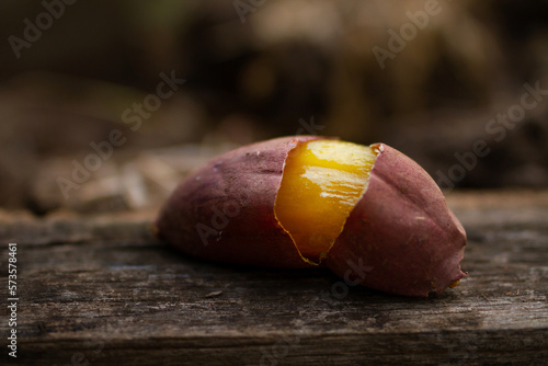 Bake Japanese sweet potato on wooden table. photo