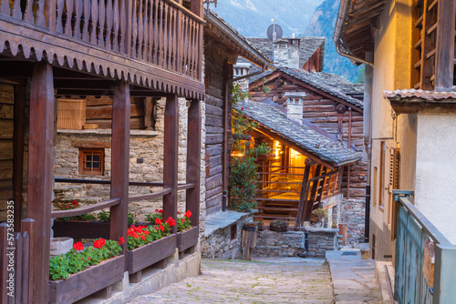 Photos The rural architecture of Alagna village in the Valsesia valley range at dusk - Italy