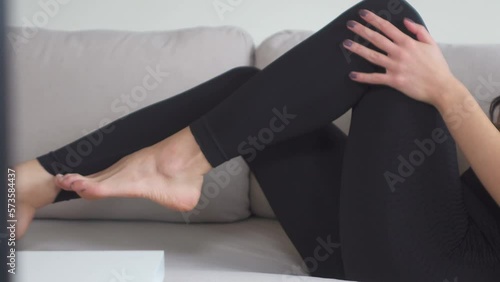 Beautiful model touching black leggings