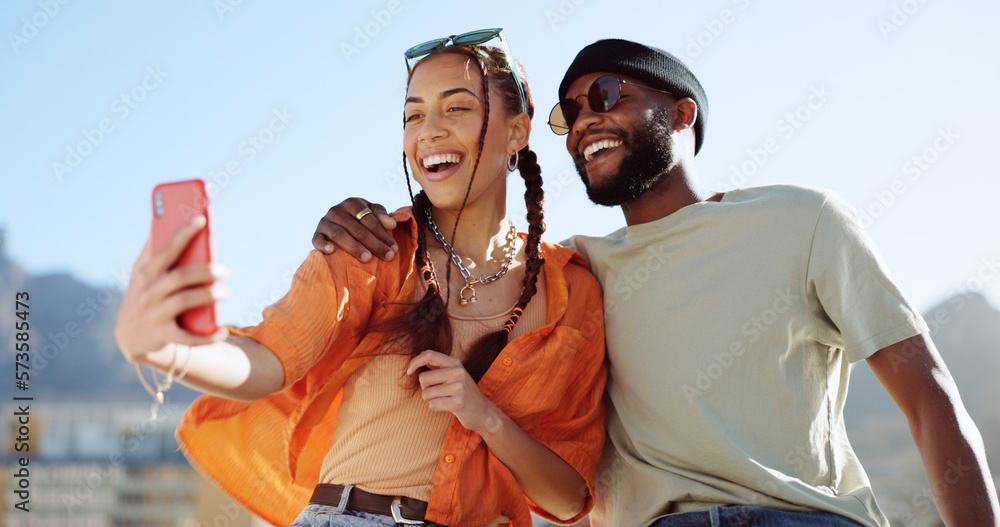 © Siphosethu F/peopleimages.com - Couple, bonding and phone selfie on city building rooftop on New York summer holiday, travel vacation date or social media memory. Smile, happy or black man and woman on mobile photography technology