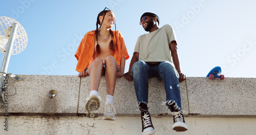 Cool, fashion and joke with young couple hang out on city building together bonding. Interracial stylish young people on a funny city date. Silly, goofy and laughing black man and woman joking