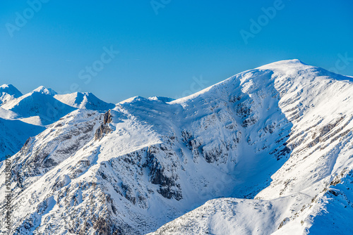 Fototapeta Naklejka Na Ścianę i Meble -  Poland 2022. Beautiful view on the snow Tatry. Zakopane, Giewont, Kasprowy Wierch, Swinica, Rysy, Kresanica.