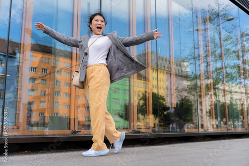 Принти на полотні carefree asian traveller female woman casual cloth happiness lifestyle walking s