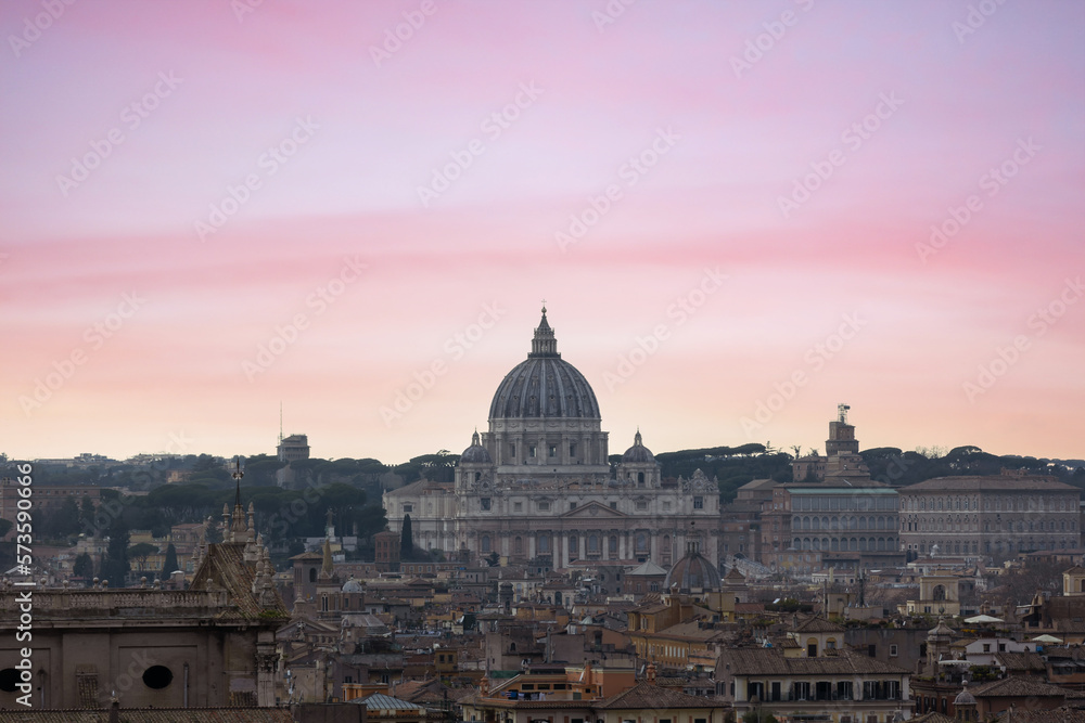 Top view from Quirinale Palace of Rome with St Peter's Basilica (San Pietro) in Vatican City, Italy at sunset. It is a famous landmark of Vatican. Nice cityscape of the old Roma