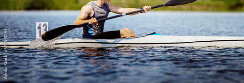 close up athlete kayaker rowing kayaking competition race