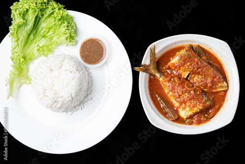 Asam Pedas Ikan translated as Spicy Sour Fish. Polular in Malaysia especially Malacca. Served on rice. photo