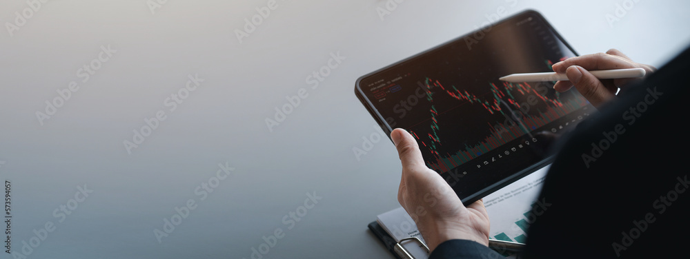 Stock price charts and stock market analysis, stock trading technology and digital assets, investors analyzing stock charts for profitable trading. Money growth. The idea of investing money to grow. - obrazy, fototapety, plakaty 