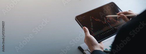 Stock price charts and stock market analysis, stock trading technology and digital assets, investors analyzing stock charts for profitable trading. Money growth. The idea of investing money to grow.