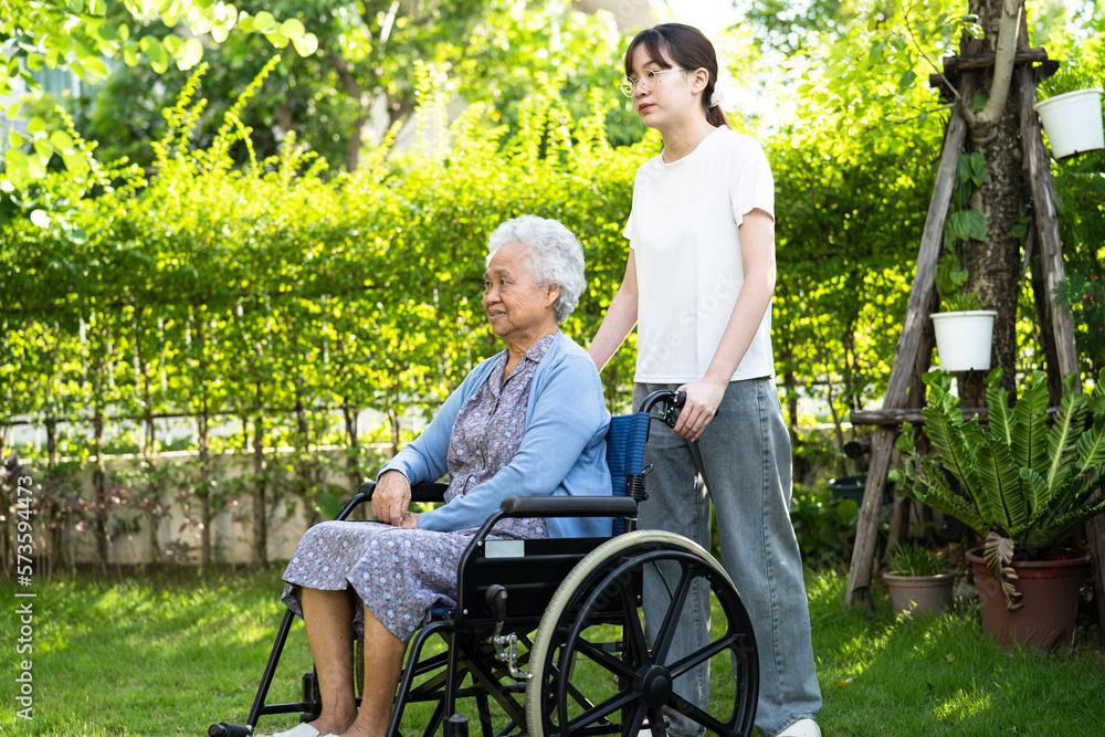 caregiver help and care Asian senior woman patient sitting on wheelchair at nursing hospital ward, healthy strong medical concept. caregiver help and care Asian senior woman patient sitting on wheelchair at nursing hospital ward, healthy strong medical concept.