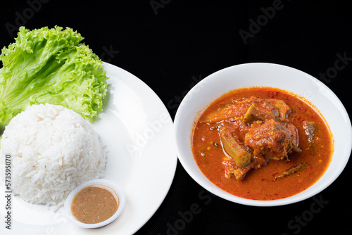 Asam Pedas Ikan translated as Spicy Sour Fish. Polular in Malaysia especially Malacca. Served on rice. photo