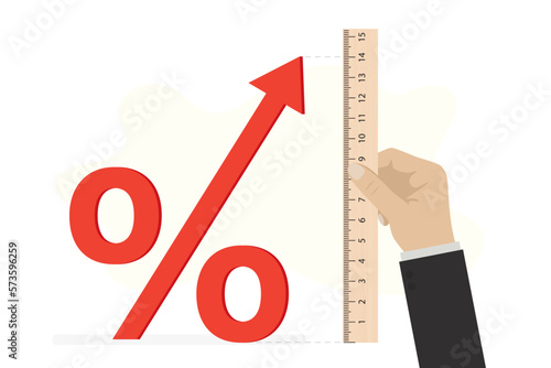 Businessman hand uses ruler and measures the inflation or high interest rates. Percent sign with rising arrow. Size of bank rate on loans. Consumer calculates and measures loan amount.