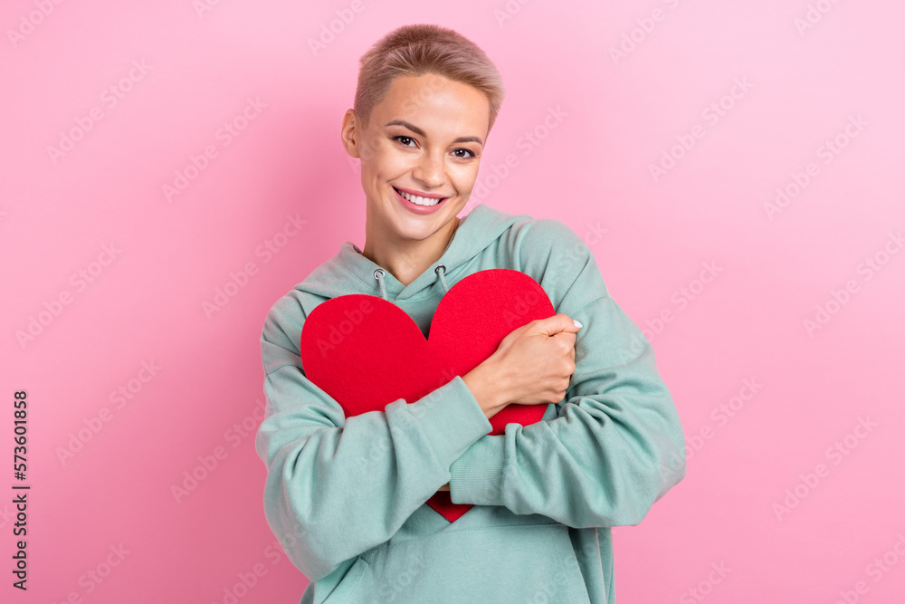 Photo portrait of attractive young woman holding hugging red heart postcard wear trendy khaki clothes isolated on pink color background Photo portrait of attractive young woman holding hugging red heart postcard wear trendy khaki clothes isolated on pink color background