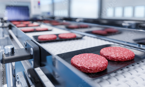 Fotografía Conveyor in a factory of ready-made beef hamburger patties - a modern ecological