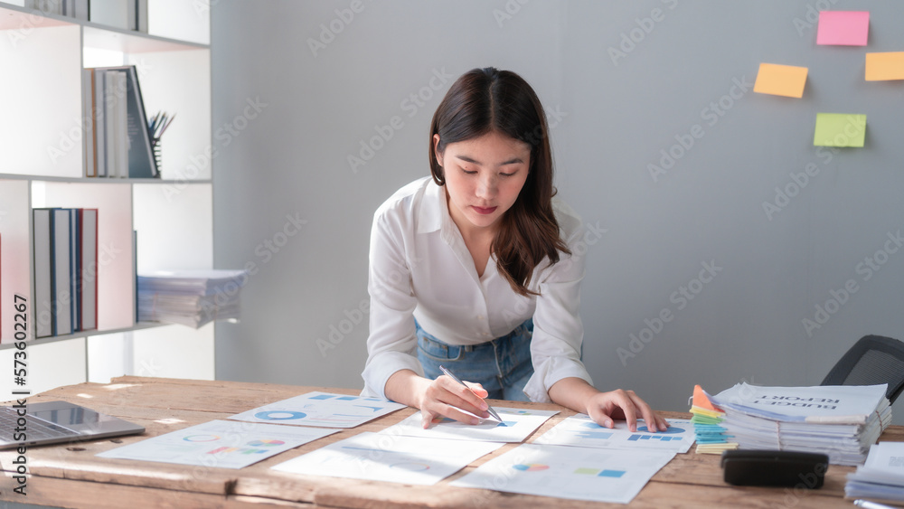 Hard working of asian people bookkeepers working with balance sheet and taxation, company quarterly reports of accounting and marketing. Hard working of asian people bookkeepers working with balance sheet and taxation, company quarterly reports of accounting and marketing.