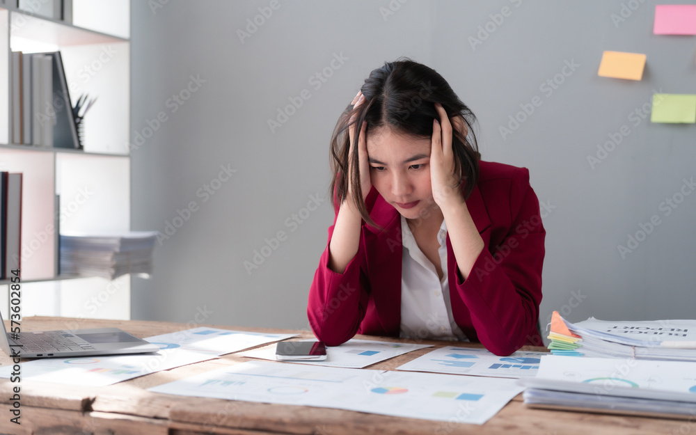 Hard working of asian people bookkeepers working with balance sheet and taxation, company quarterly reports of accounting and marketing. stressed, headache Hard working of asian people bookkeepers working with balance sheet and taxation, company quarterly reports of accounting and marketing. stressed, headache