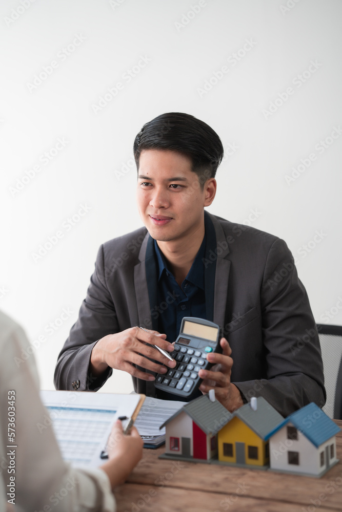 Sealing a deal. Asian people business real estate agent with client consulting and discussing at office desk. talking with contract agreement before signing.