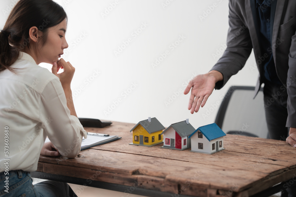 Sealing a deal. Asian people business real estate agent with client consulting and discussing at office desk. talking with contract agreement before signing. Sealing a deal. Asian people business real estate agent with client consulting and discussing at office desk. talking with contract agreement before signing.
