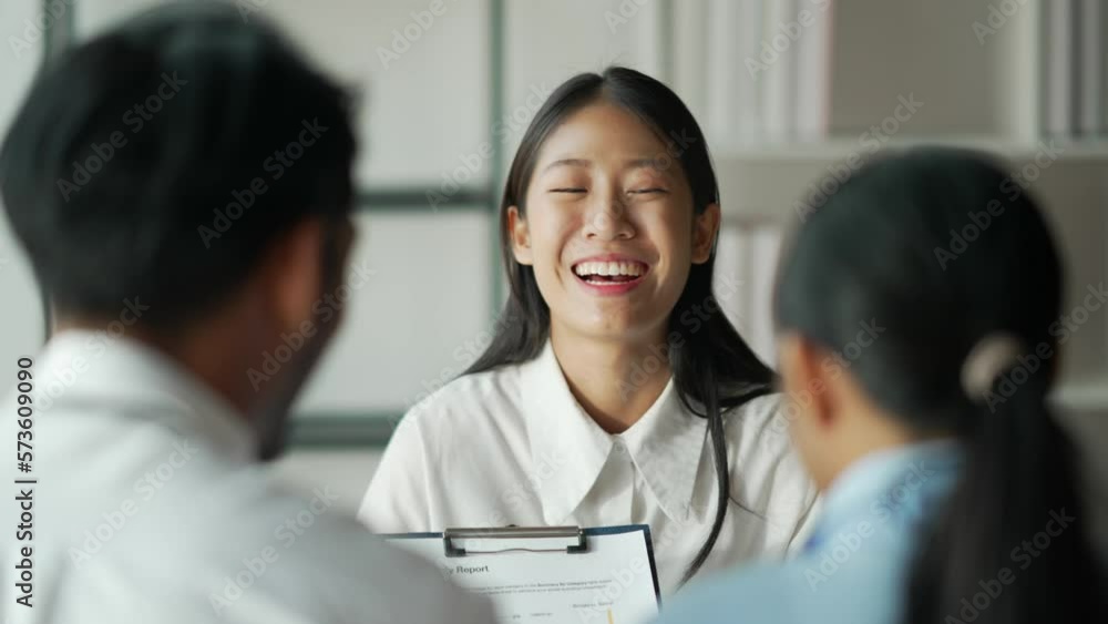 Asian business advisor meeting to analyze and discuss the situation on the financial report in the meeting room. Asian business advisor meeting to analyze and discuss the situation on the financial report in the meeting room.